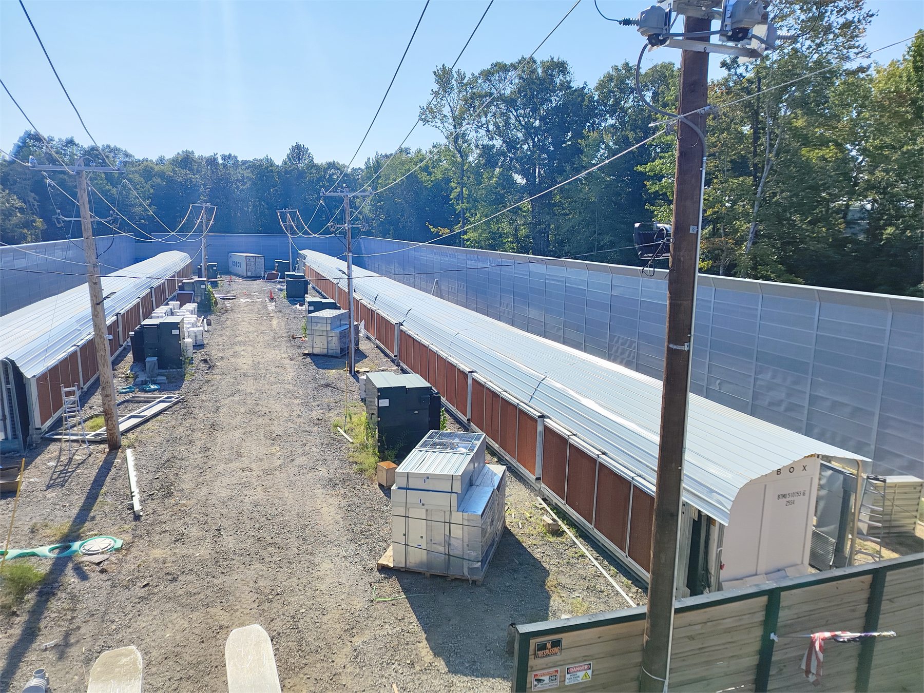 Data center site with access lanes, utility corridors, and equipment areas