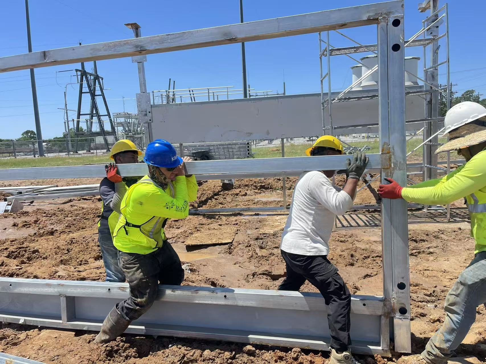 Field crew installing structural framing at an infrastructure site