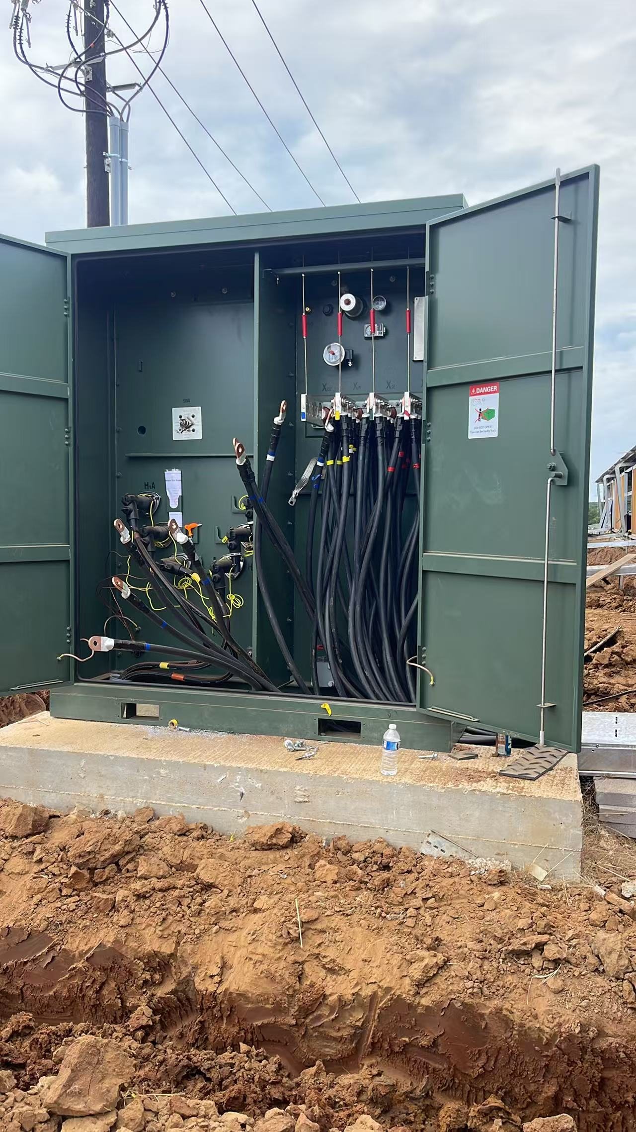 Open transformer cabinet used to document equipment condition