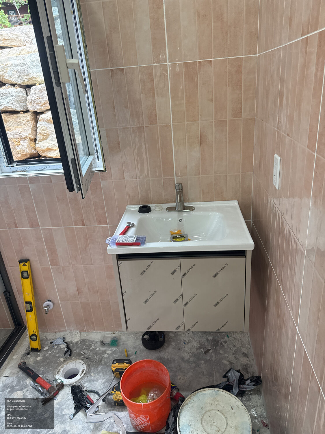 Residential bathroom vanity and plumbing under installation