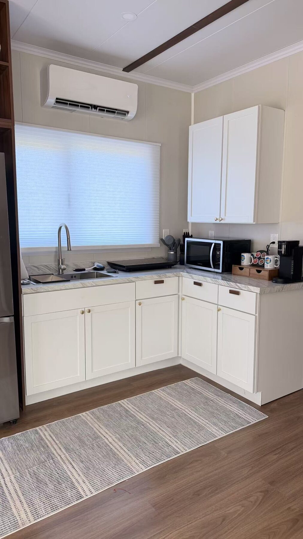 Completed kitchen with residential cabinetry and fixtures